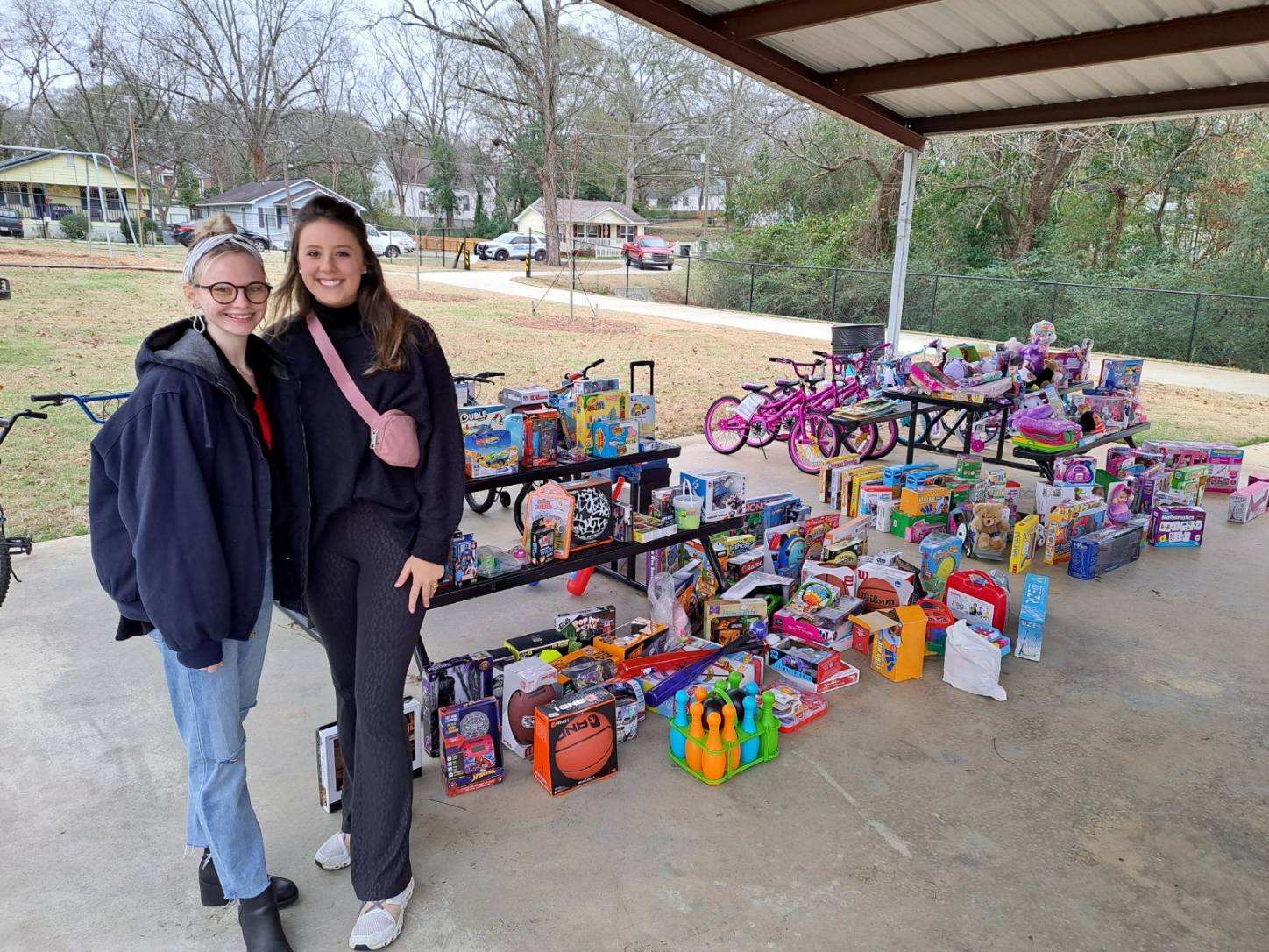 Scholars pose with donated toys
